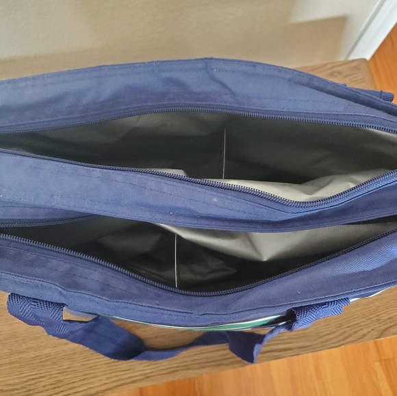 A blue, white, and green striped soft pack igloo. - Picture 4 of 4